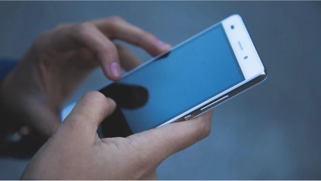hands holding phone